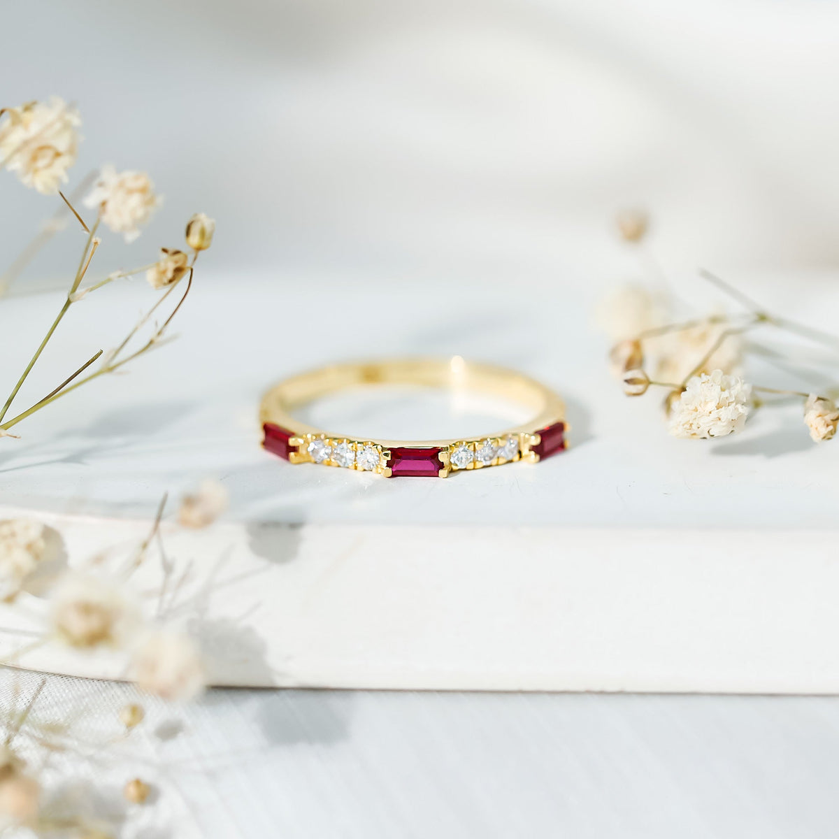 Rosec Jewels Baguette Cut Lab Grown Ruby vintage eternity ring with diamond accents, showcasing intricate design and sparkling gemstones.