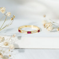 Rosec Jewels Baguette Cut Lab Grown Ruby vintage eternity ring with diamond accents, showcasing intricate design and sparkling gemstones.