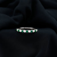 Trellis Set Round Emerald and Diamond Half Eternity Ring