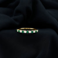 Trellis Set Round Emerald and Diamond Half Eternity Ring