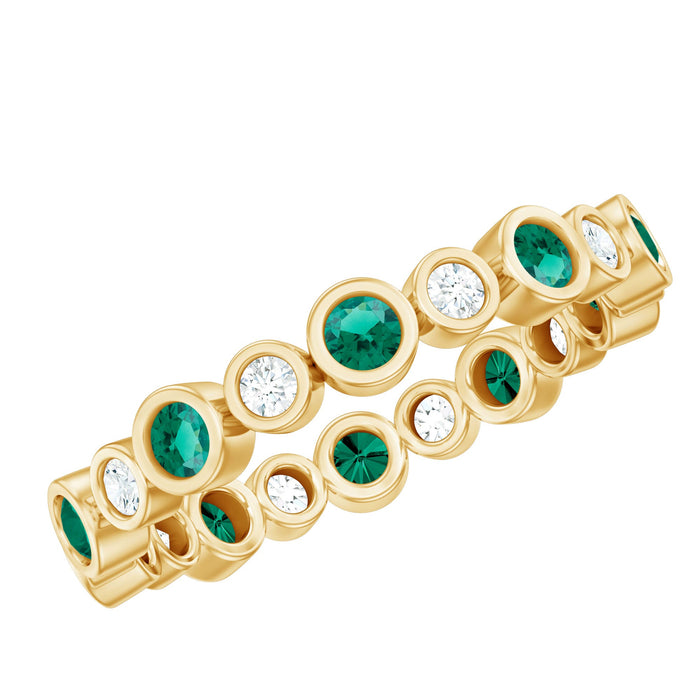 Rosec Jewels alternating lab emerald and moissanite full eternity ring with sparkling gemstones in a continuous band.