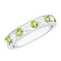 Channel set peridot and diamond half eternity ring for women by Rosec Jewels, featuring vibrant green gemstones and sparkling diamonds.