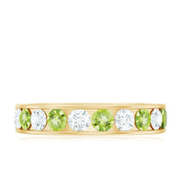 Channel set peridot and diamond half eternity ring for women by Rosec Jewels, featuring vibrant green gemstones and sparkling diamonds.
