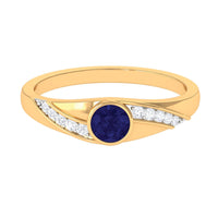 Bezel set blue sapphire and diamond engagement ring for men by Rosec Jewels, featuring a sleek band with blue gemstone and sparkling diamonds.