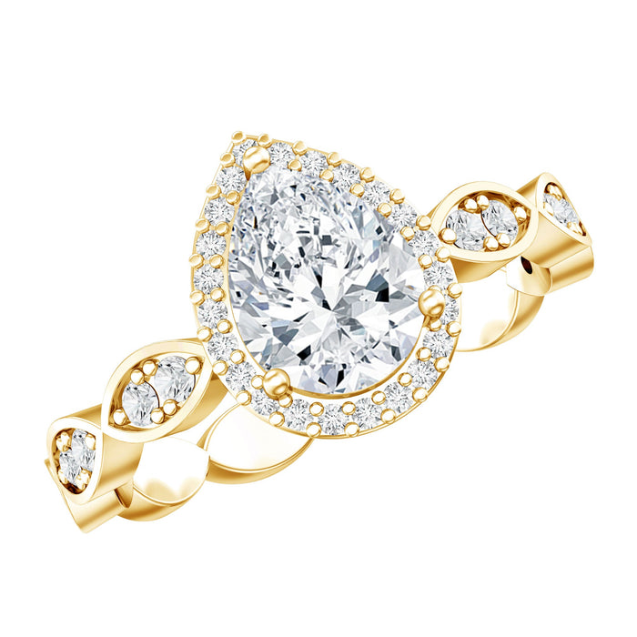 Moissanite teardrop engagement ring with scalloped shank by Rosec Jewels, featuring a sparkling teardrop-shaped center stone and intricate band.