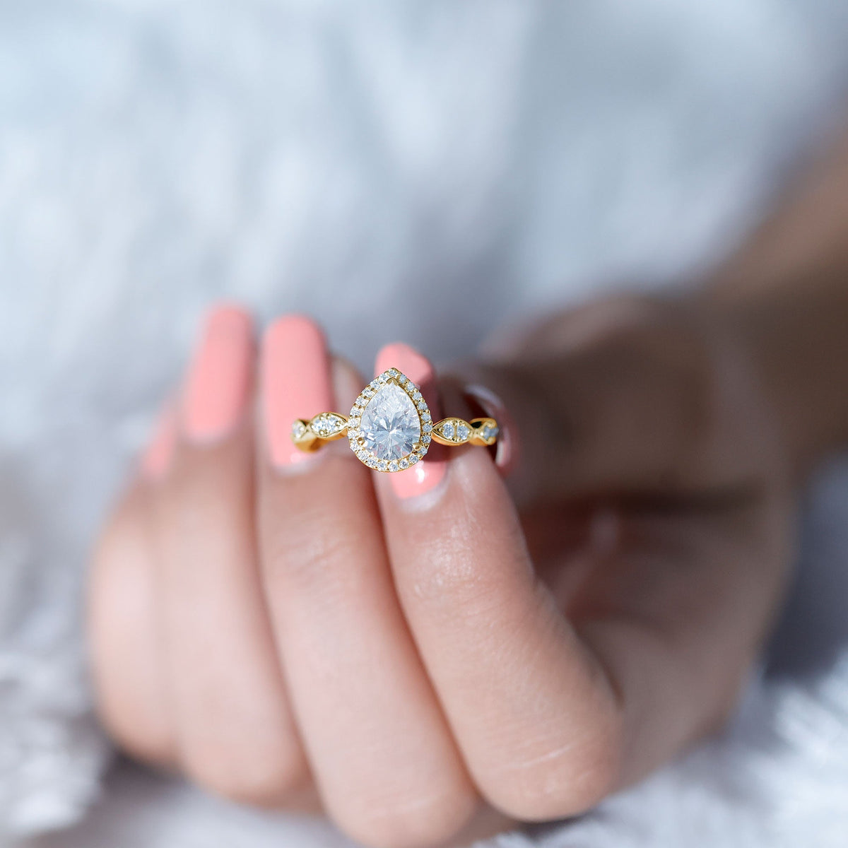 Moissanite teardrop engagement ring with scalloped shank by Rosec Jewels showcasing sparkling stone and intricate band detail