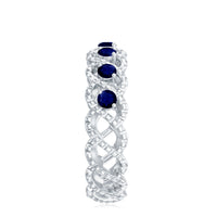 Natural blue sapphire infinity ring by Rosec Jewels featuring a band with blue sapphires and infinity design, suitable for anniversaries.