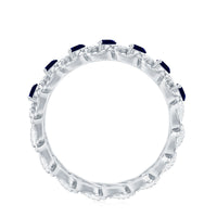 Natural blue sapphire infinity ring by Rosec Jewels featuring a continuous band of blue sapphires for anniversary.