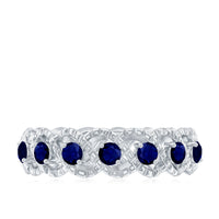 Natural blue sapphire infinity ring for anniversary by Rosec Jewels, showcasing a sparkling blue sapphire gemstone in a sleek band.