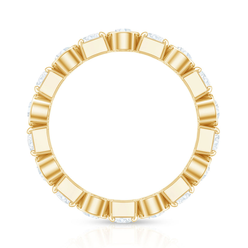 Round moissanite eternity wedding band by Rosec Jewels featuring sparkling stones and a sleek, polished silver finish.
