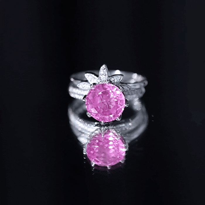 Floral-inspired lab-grown pink sapphire wedding ring set with moissanite stones from Rosec Jewels, showcasing intricate design and sparkle.