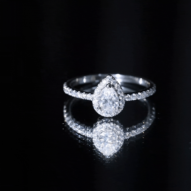 Yellow lab-grown diamond teardrop halo engagement ring with intricate band design by Rosec Jewels.