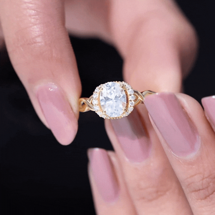 Yellow gold lab grown diamond oval engagement ring for women with 6x8 mm oval center stone and intricate band details.