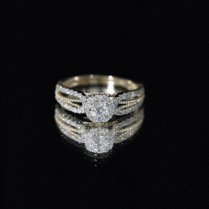 Yellow vintage-style engagement ring with a lab-grown diamond, featuring intricate detailing and a classic design by Rosec Jewels.