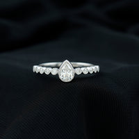 Lab Grown Diamond 5X7 MM Pear Shaped Engagement Ring With Side Stones
