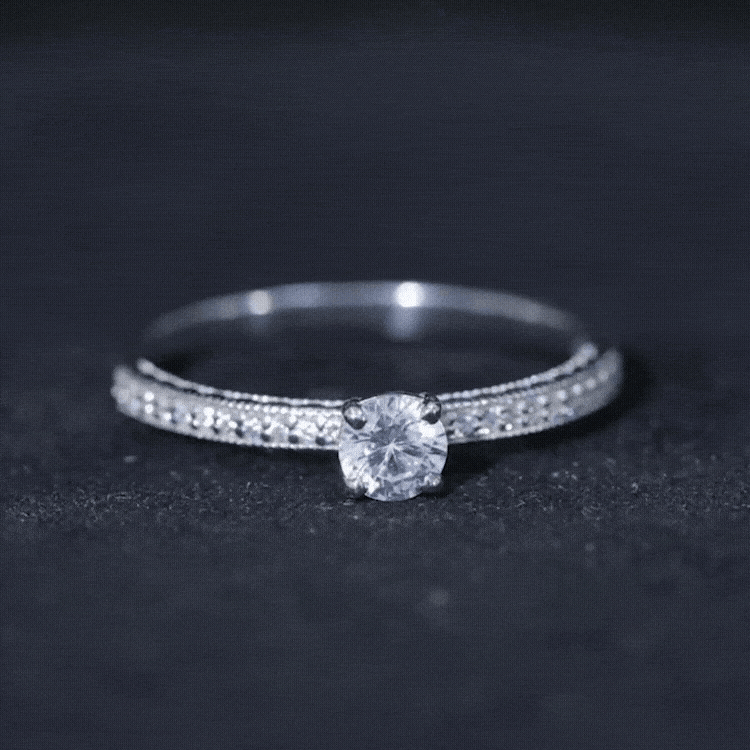 Yellow 5mm lab-grown diamond engagement ring with side stones from Rosec Jewels, showcasing the detailed design and sparkling gemstones.
