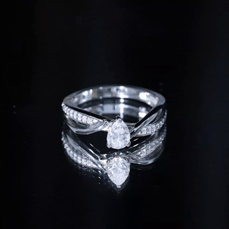 Yellow gold engagement ring with a 5x7 mm pear-shaped lab-grown diamond from Rosec Jewels. Elegant jewelry design.