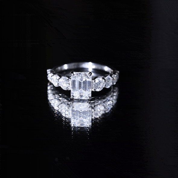 Yellow gold lab-grown diamond engagement ring with an 8x6mm emerald cut center stone and side stones, from Rosec Jewels.