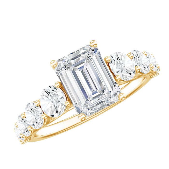 Rosec Jewels lab grown diamond engagement ring with 6x8mm emerald cut center stone and side stones on a silver band.