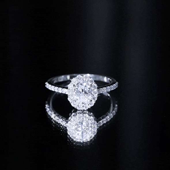 Lab grown 1.2 carat oval halo engagement ring with side stones by Rosec Jewels, featuring a yellow gold band and detailed design.