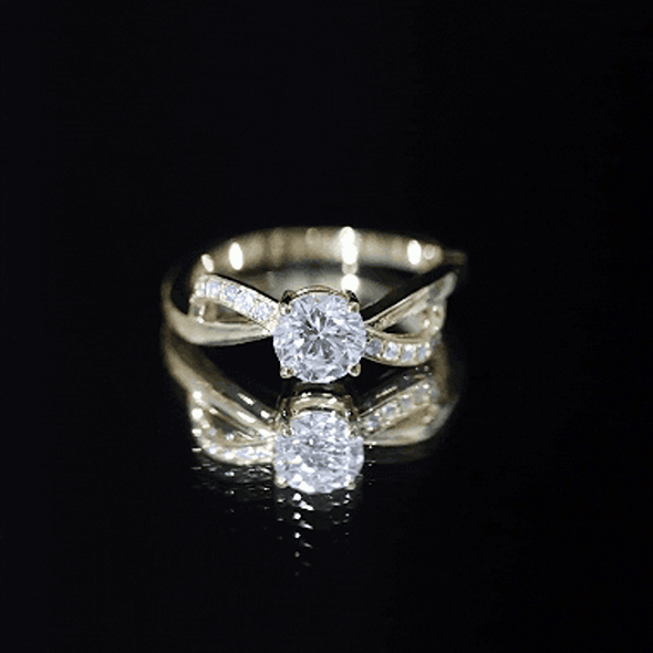 Yellow gold infinity engagement ring with a 0.9 carat lab-grown diamond from Rosec Jewels, featuring a sleek, elegant design.