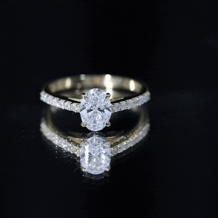 Yellow gold engagement ring with a 2 carat certified lab-grown diamond and side stones, crafted by Rosec Jewels.