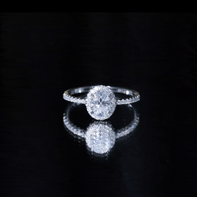 Yellow gold oval lab grown diamond engagement ring with side stones by Rosec Jewels, showcasing the sparkling 1.2 carat center stone.