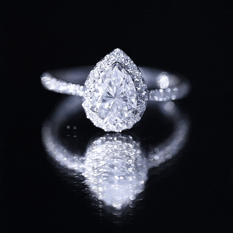 Yellow gold Rosec Jewels lab-grown diamond pear halo engagement ring with a central pear-shaped diamond and intricate halo design.