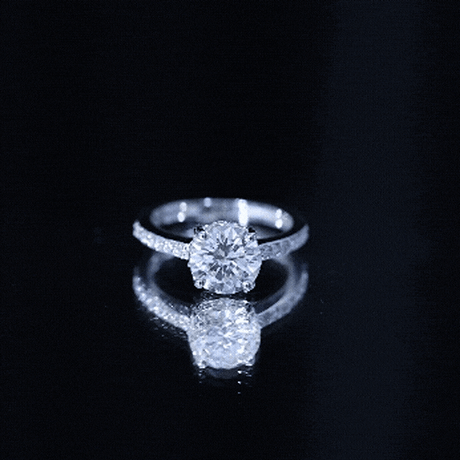 Yellow gold 2 carat lab-created diamond round engagement ring with hidden halo and intricate band design by Rosec Jewels.