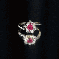 Natural 0.6 carat ruby flower engagement ring with diamond bypass shank by Rosec Jewels, featuring vibrant ruby and sparkling diamonds.