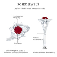 Natural 0.6 carat ruby flower engagement ring with diamond bypass shank from Rosec Jewels, showcasing a floral ruby design and sparkling accents.