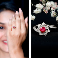 Natural 0.6 carat ruby flower engagement ring with diamond bypass shank by Rosec Jewels, featuring a floral design and sparkling diamonds.