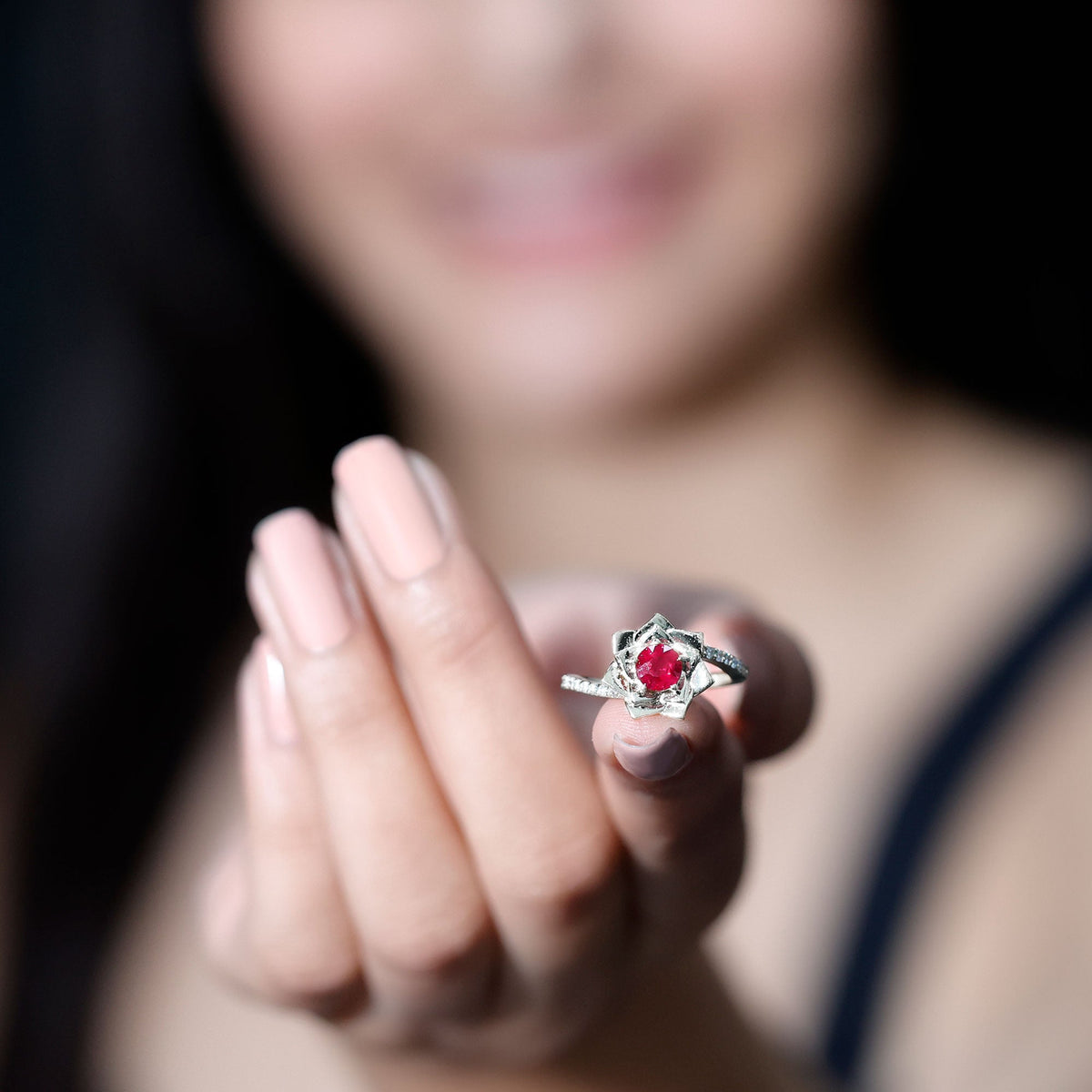 Natural 0.6 carat ruby flower engagement ring with diamond accents and bypass shank by Rosec Jewels.