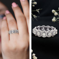 Rosec Jewels certified moissanite statement wedding band for women, showcasing a sparkling ring with intricate design details.