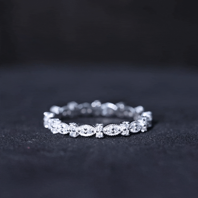 Yellow gold moissanite eternity ring for women by Rosec Jewels, featuring a continuous row of sparkling stones on a sleek band.