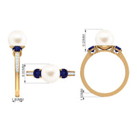 White pearl and sapphire 3-stone engagement ring with diamonds from Rosec Jewels, showcasing elegant jewelry craftsmanship.