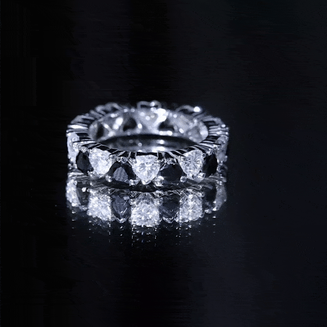 Heart-shaped lab-grown black diamond eternity ring with Moissanite stones by Rosec Jewels, showcasing intricate design and sparkling gemstones.