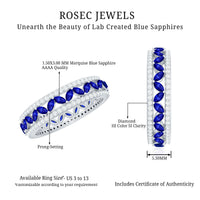 Marquise lab-created blue sapphire and diamond wedding band ring by Rosec Jewels, showcasing sparkling gemstones on a sleek band.