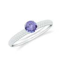 Natural Tanzanite engagement ring with pave diamond side stones, featuring a elegant design and detailed craftsmanship from Rosec Jewels.