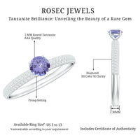 Natural Tanzanite engagement ring with pave diamond side stones, featuring a silver band and intricate detailing.
