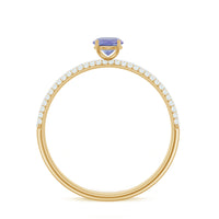 Natural Tanzanite engagement ring by Rosec Jewels featuring pave diamond side stones and a detailed band design.