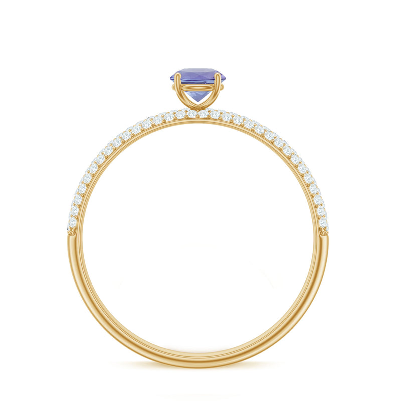 Natural Tanzanite engagement ring by Rosec Jewels featuring pave diamond side stones and a detailed band design.