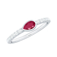 Pear-shaped ruby promise ring with diamond accents from Rosec Jewels, showcasing the elegant East West style design.