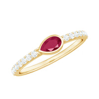 Pear-shaped ruby promise ring with diamond accents from Rosec Jewels, showcasing a stunning East West style design.