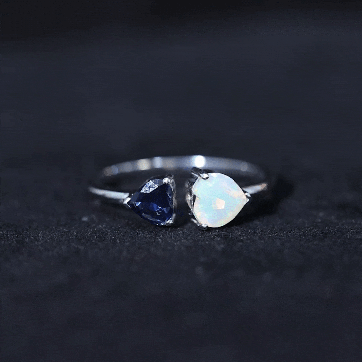 Natural heart-shaped Ethiopian opal and blue sapphire promise ring with silver band from Rosec Jewels.