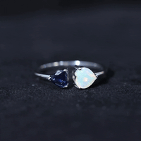 Natural heart-shaped Ethiopian opal and blue sapphire promise ring with silver band from Rosec Jewels.