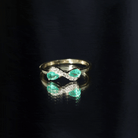 Natural Pear Emerald and Diamond Infinity Promise Ring by Rosec Jewels, featuring a pear-shaped emerald and sparkling diamonds.