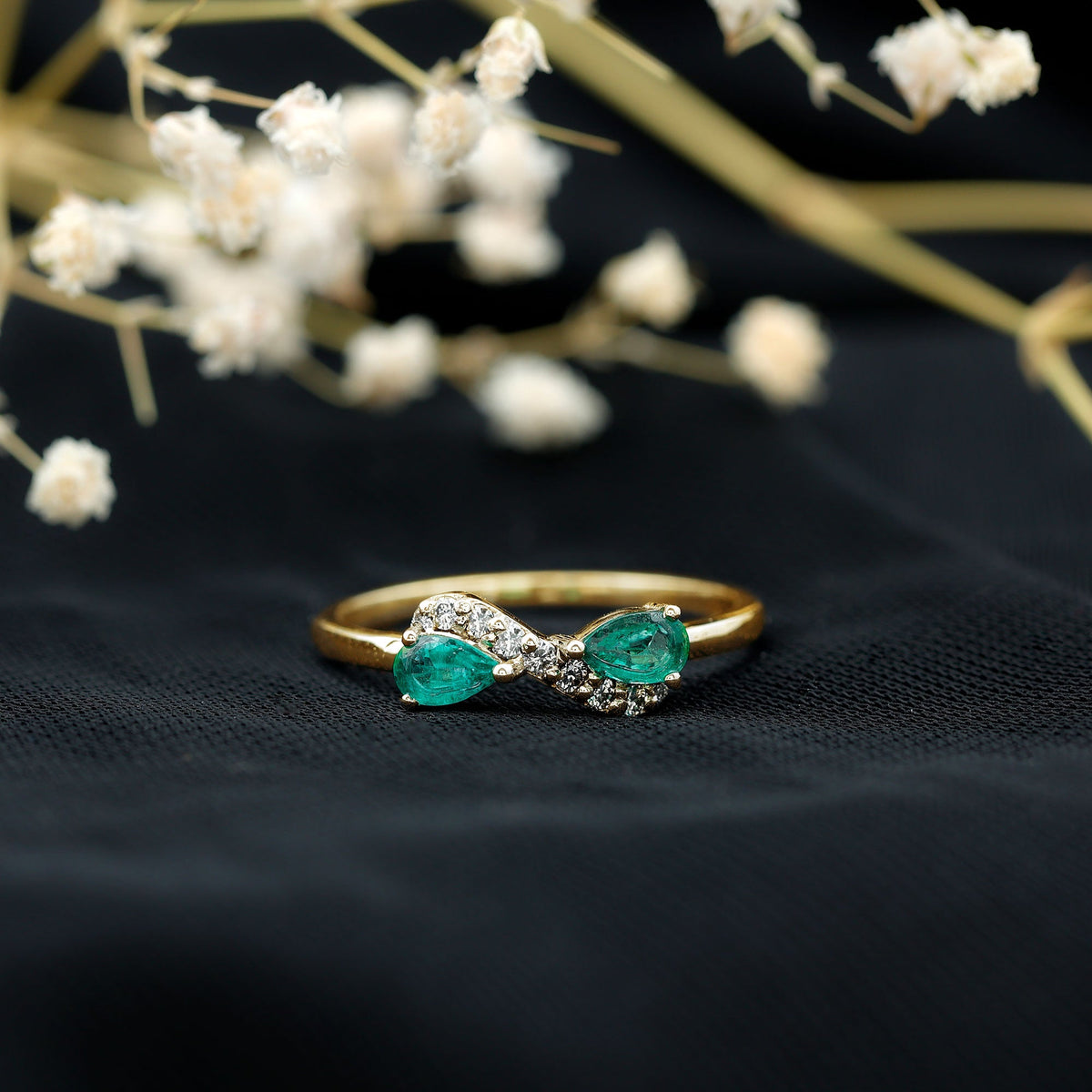 Natural Pear Emerald and Diamond Infinity Promise Ring by Rosec Jewels, featuring a pear-shaped emerald and sparkling diamonds in a delicate band.
