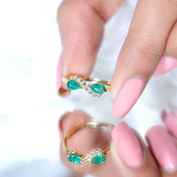 Natural Pear Emerald and Diamond infinity promise ring by Rosec Jewels, featuring a detailed view of the elegant ring design.