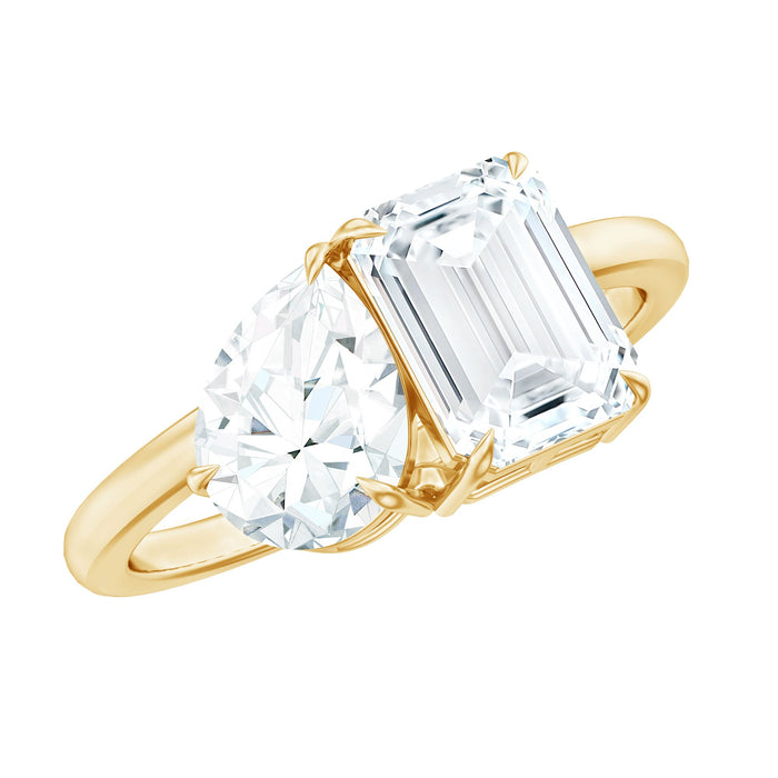 Pear and emerald cut moissanite toi et moi engagement ring by Rosec Jewels featuring elegant design and sparkling gemstones.